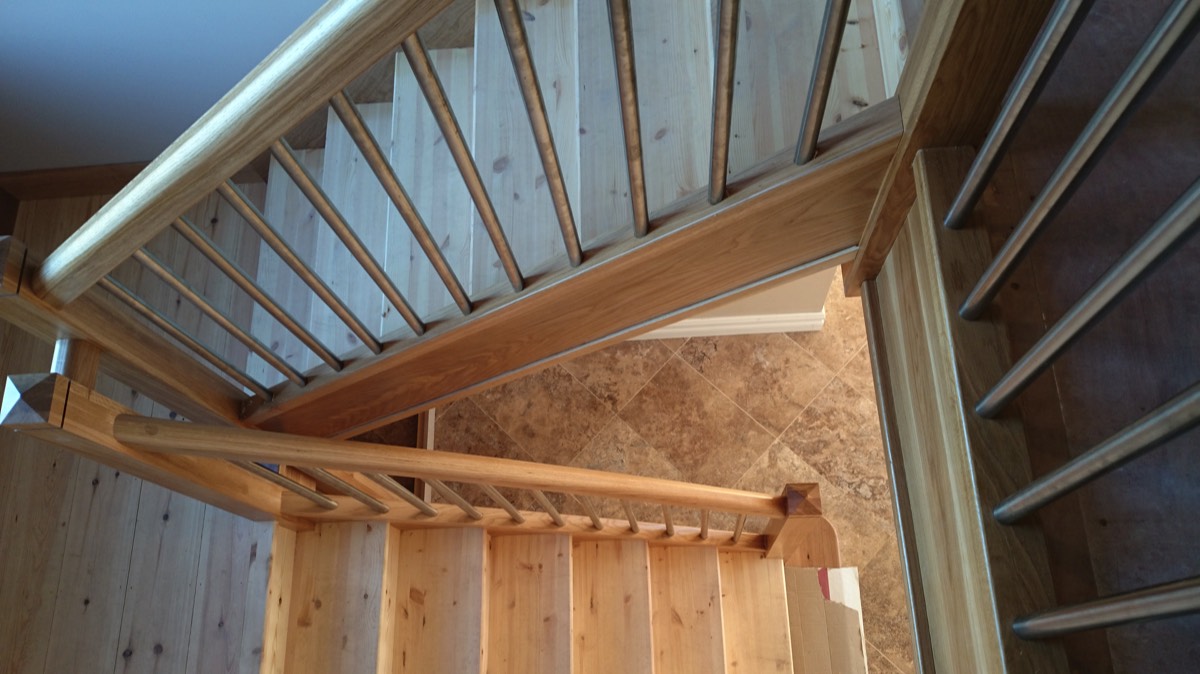 Wooden and metal return stairs